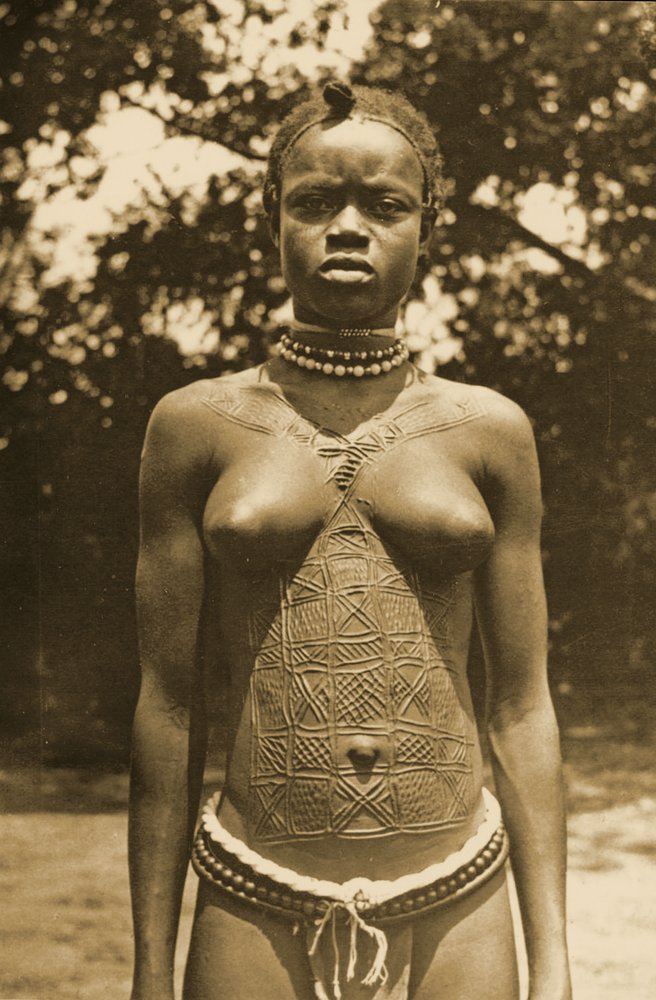 Woman from Guinea with traditional scarification, c. 1905 by Unknown