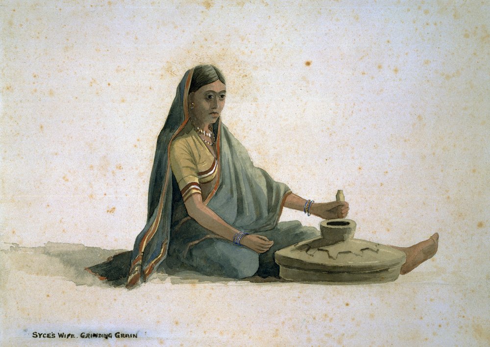 Syce's wife, grinding grain, India