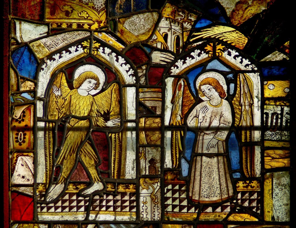 A panel in the east window depicting angels, one feathered by English School