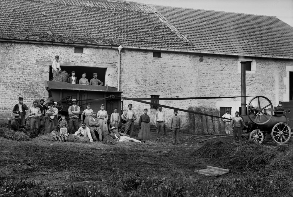 Agricultural workers and the press tied hay boots on a farm near Bourmont in Haute-Marne, around 1890. Photography. Ducos Collection. by French Photographer