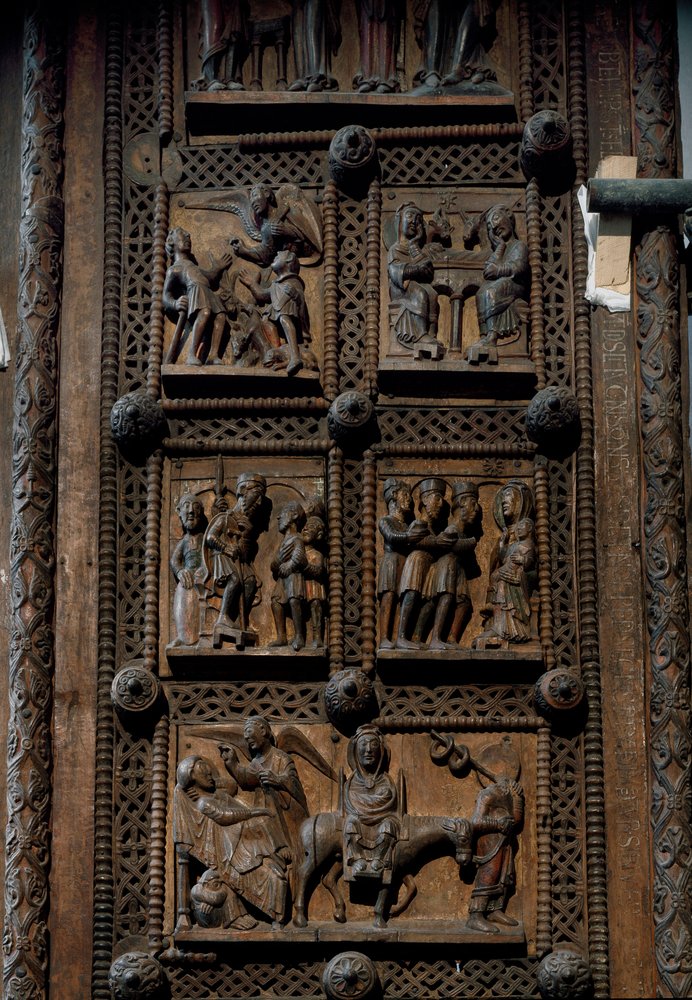 Romanesque art: wooden door from the middle of the 12th century of the Church of St. Mary of the Capitol in Cologne, Germany. Scenes depicting the announcement to the shepherds, the Nativity, the Adoration of the Magi and th by Romanesque