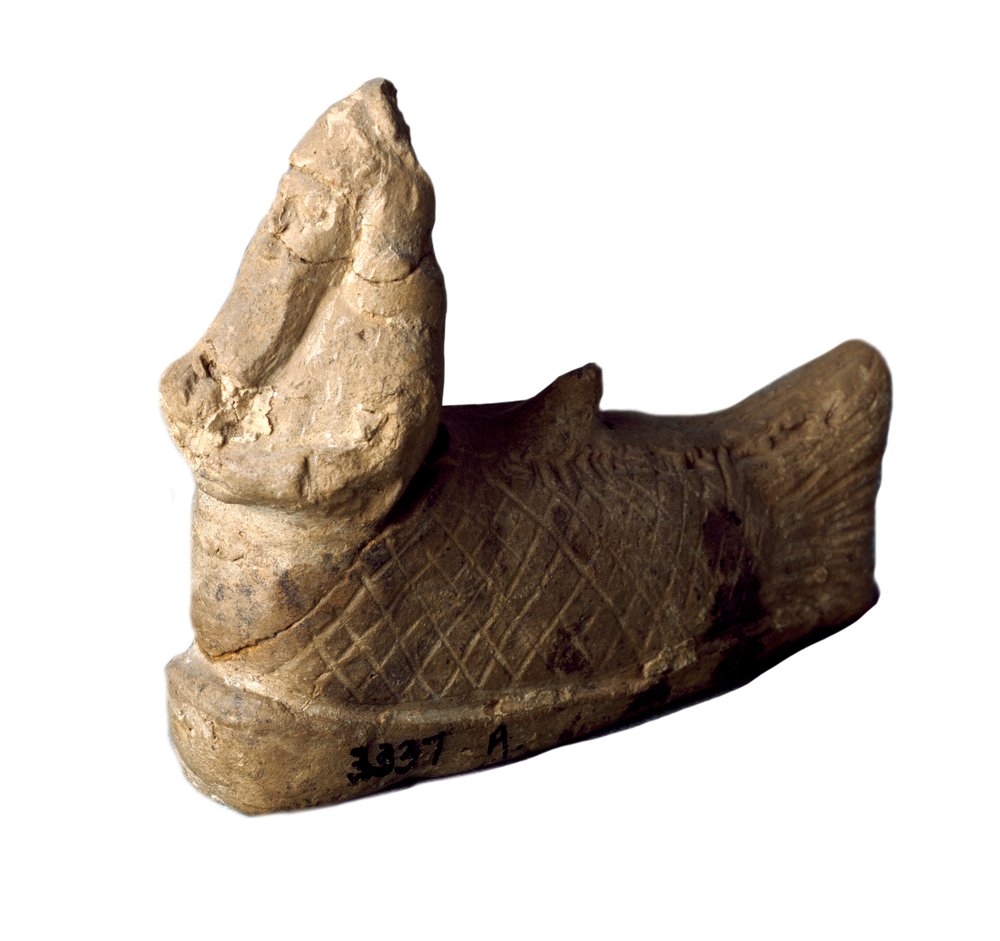 Sumerian civilization: terracotta statuette of a protective genie in the shape of a fish-man, placed under the foundations of a house. 8th-7th century BC. Dimensions: 12 x 9.7 cm. Baghdad, National Museum of Iraq by Sumerian Sumerian