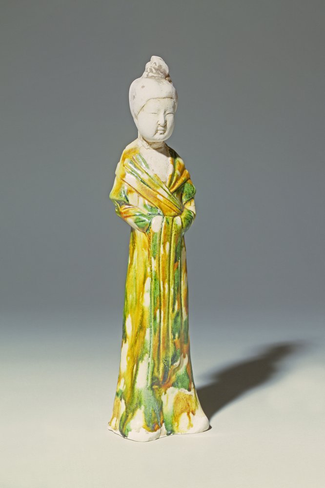 Sancai pale pottery figure of a standing court lady, Tang Dynasty by Tang Dynasty Chinese School
