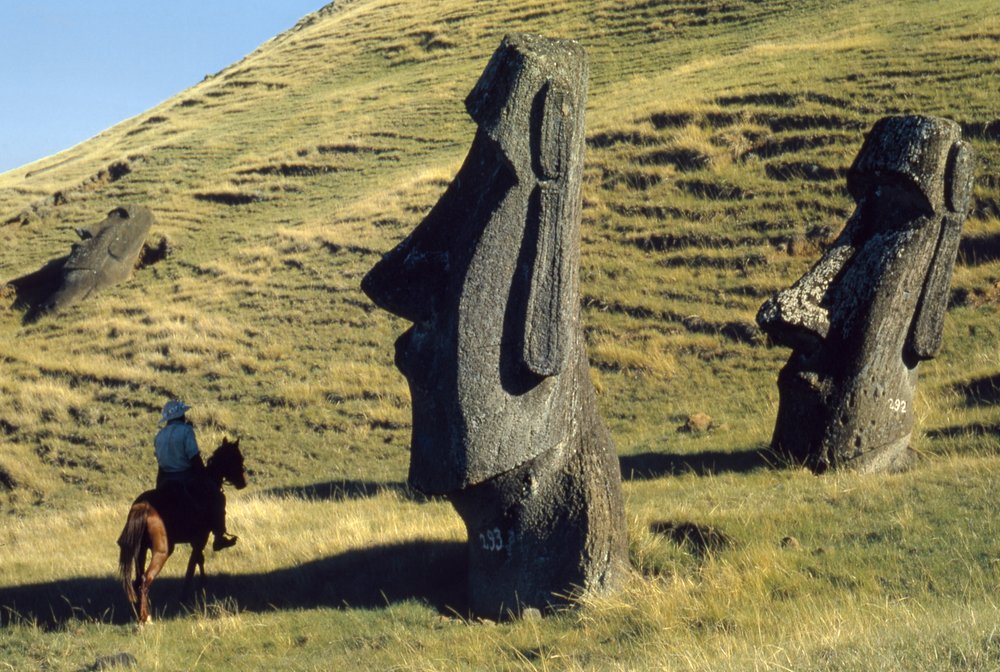 Easter Island monoliths called moai in a volcanic landscape are ancient ...