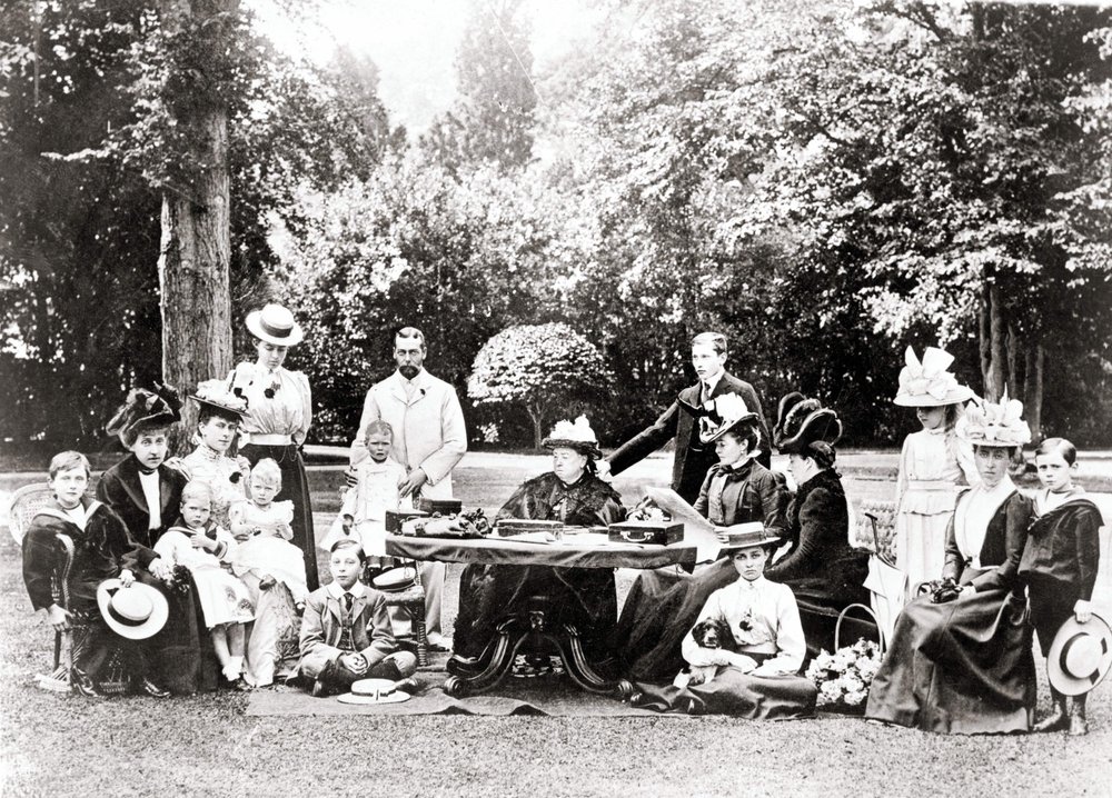 Members of the British Royal Family including King George V, King Edward VIII around Queen Victoria at a garden party by Unknown photographer