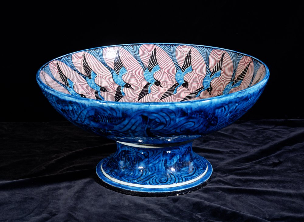 Deep punch bowl, with two eagles in the centre surrounded by swallows