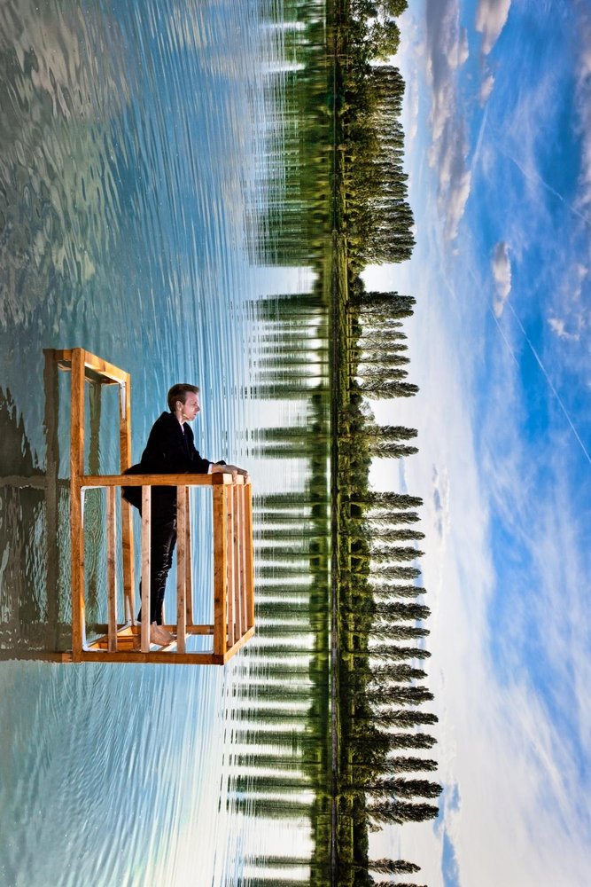 Man And Mirrored Sky by Christophe Kiciak