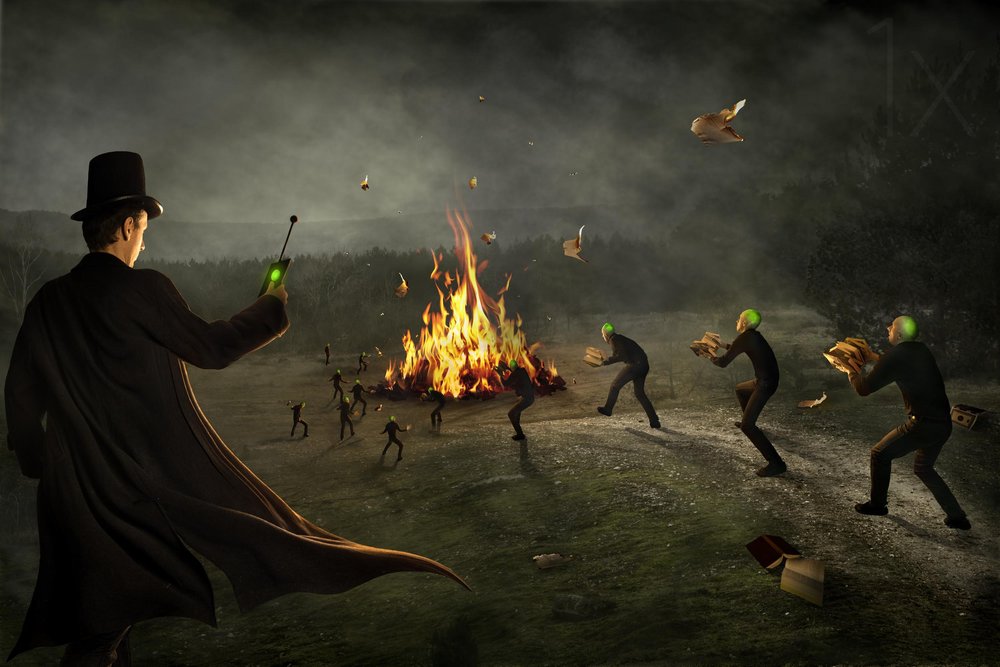 Mysterious Man Burning Books by Christophe Kiciak