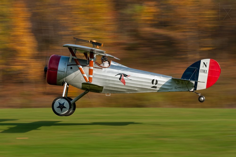 Vintage Biplane Taking Off by Darek Siusta