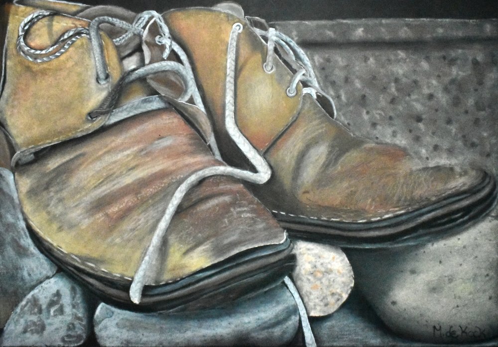 Old Boots on Rocks by Marchelle de Kock