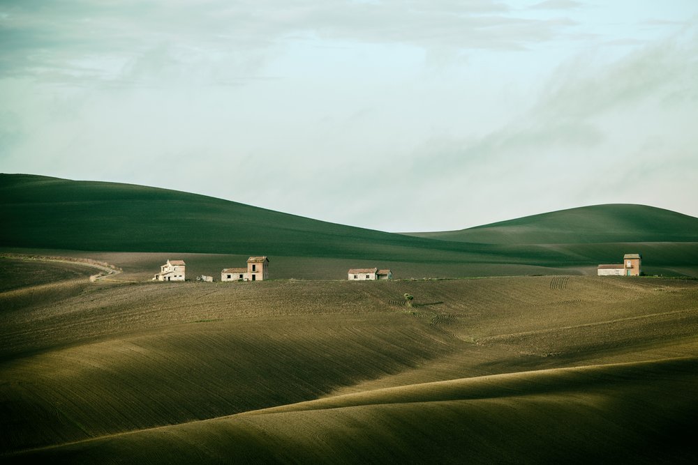 Rolling Hills Distant Homes by Nicola Figliuolo
