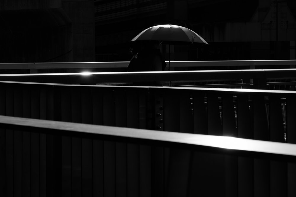 Solitary Umbrella Walk by Satoshi Hata