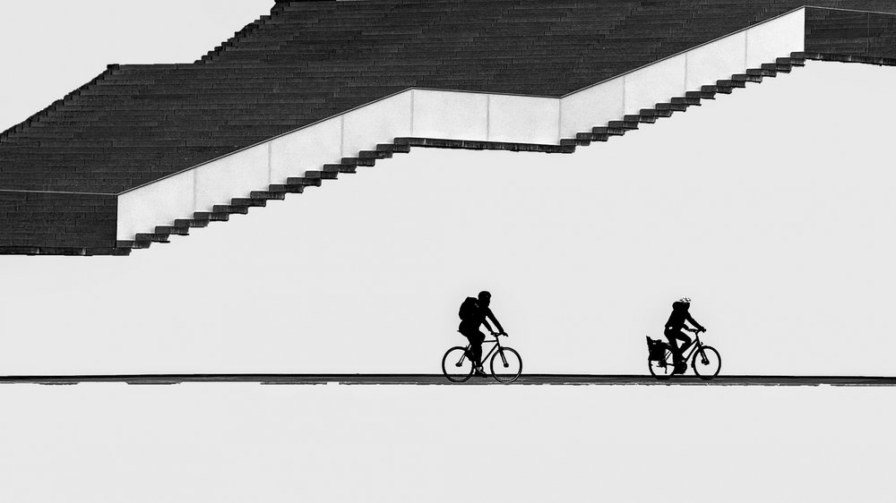 Silhouetted Cyclists Stairs by Shanrui Ren
