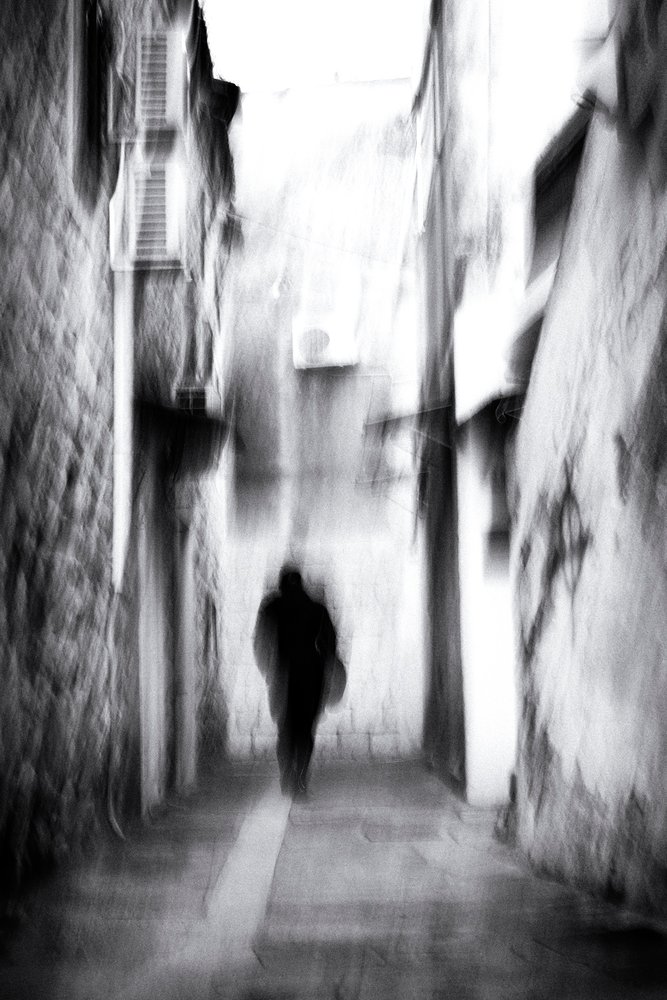 Blurred Figure In Alley von Tito Mindoljevic