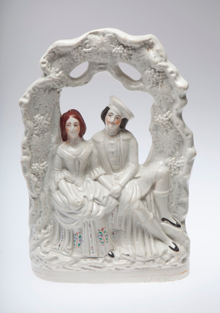 Staffordshire Ceramic Figurine of a Couple Seated Holding Hands by Unknown