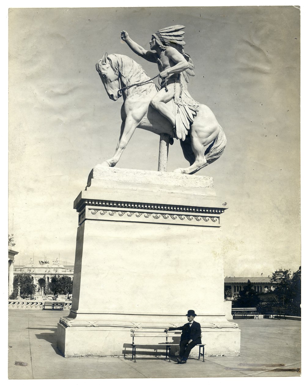 Statue of an American Indian Seated on a Horse on Top of a Large Pedestal by Unknown