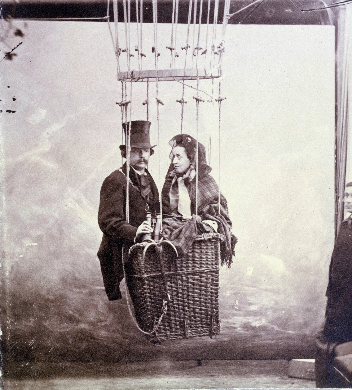 Photographic portrait of photographer and aerostat pilot Felix Tournachon dit Nadar and his wife posing in a balloon basket by Nadar