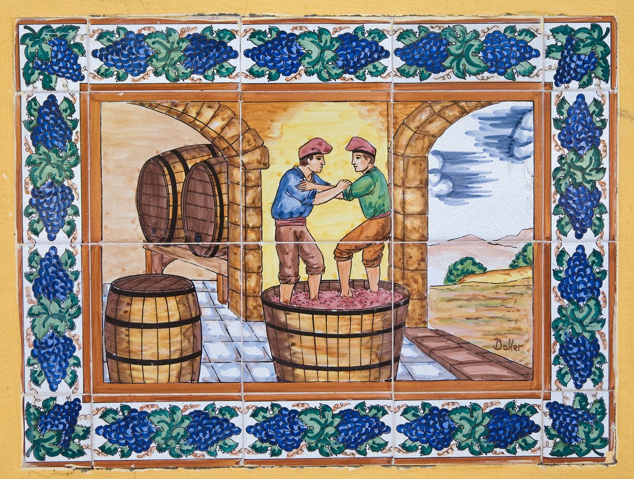 Modern Spanish Ceramic Tiles Showing Workers Treading on Grapes in Tub in Vineyard Cellar by Unknown