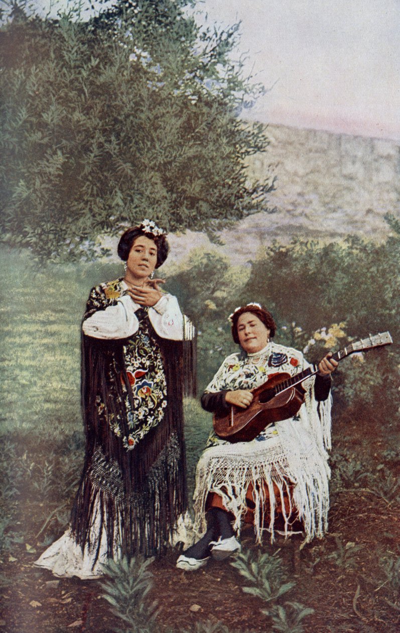 While her companion plays the guitar, the young girl lightly claps her hands. Most Spanish dancers favor this form of accompaniment by Unknown