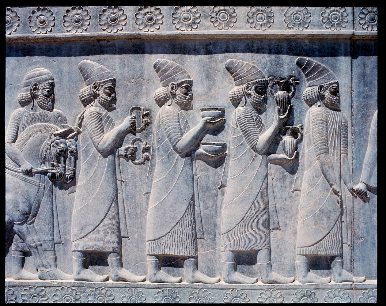 View of the reliefs of eastern stairs: Assyrian ambassadors bringing offers and presents by Achaemenid
