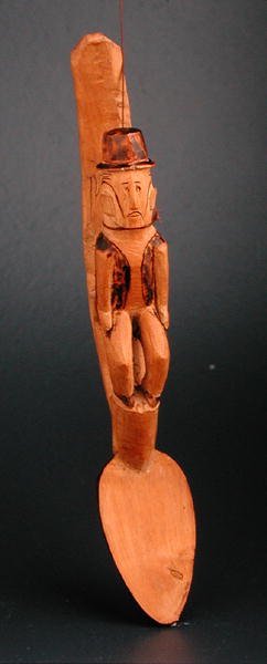 Figure of a European man seated on shaft of a spoon, South East Africa, late 19th century by African