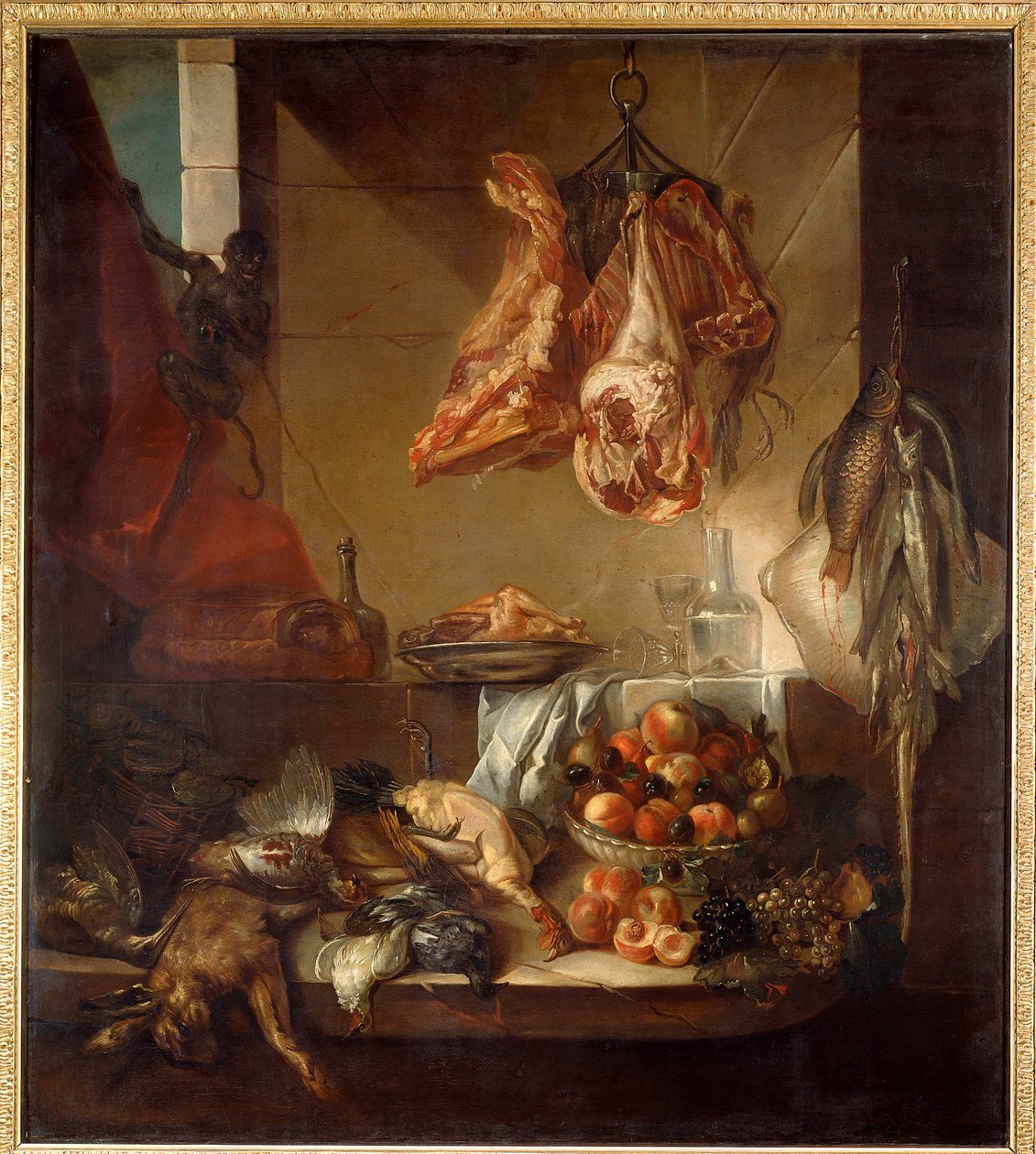 A kitchen interior still life of game, fruit and meat by Alexandre Francois Desportes