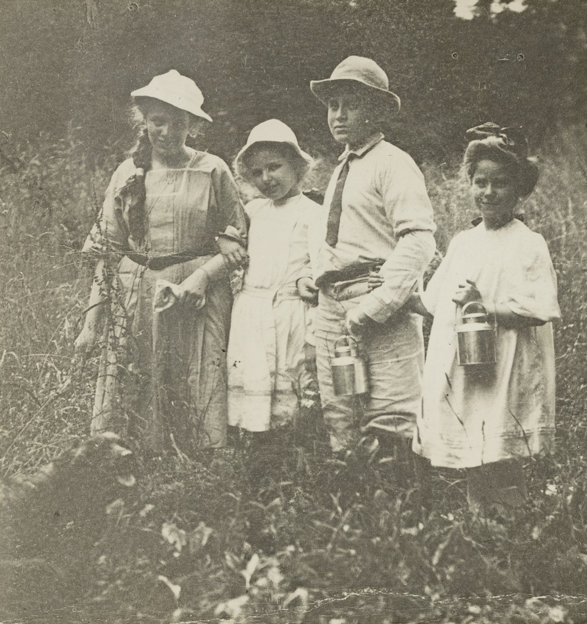 Untitled Flora, Elizabeth, Howard & Kitty in Lake George Field by Alfred Stieglitz