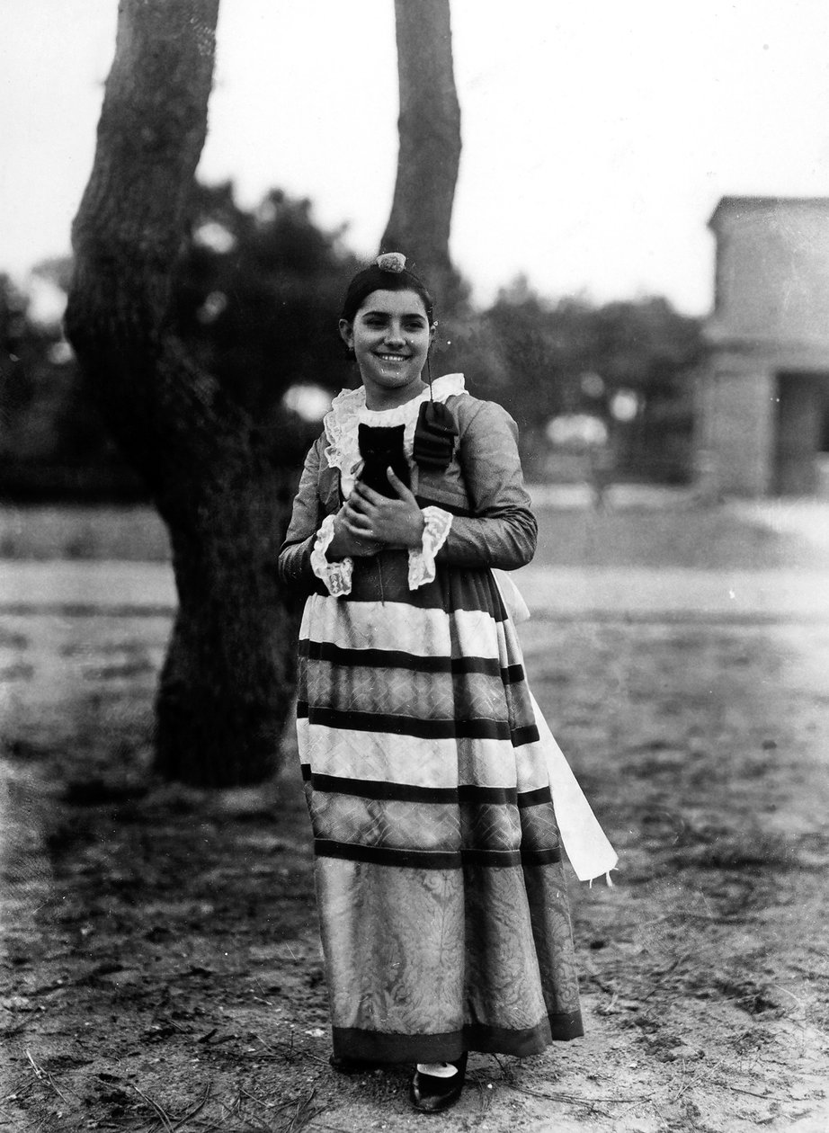 Villa Rosa Maltoni Mussolini: portrait of an adolescent holding a small cat, wearing a traditional Italian costume by Fratelli Alinari