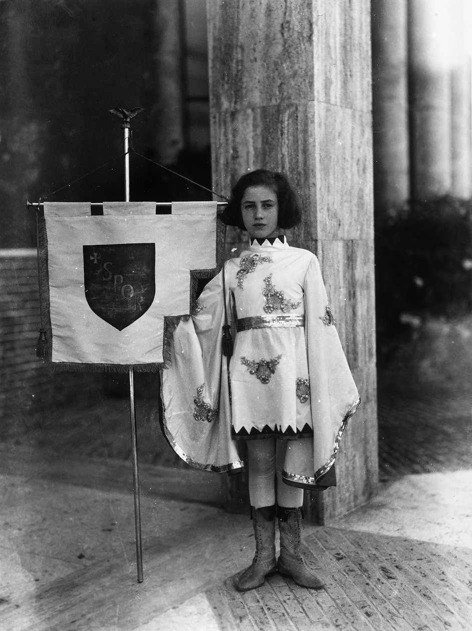 Villa Rosa Maltoni Mussolini: young girl dressed as a page boy with the banner of the city of Rome by Fratelli Alinari
