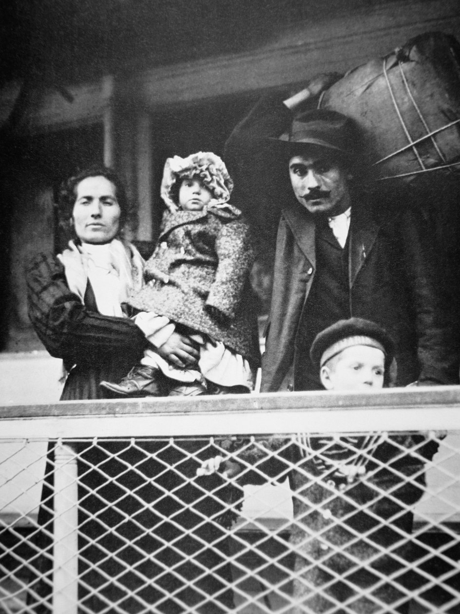A migrant Italian family on the ferry from Ellis Island to New York City by American Photographer