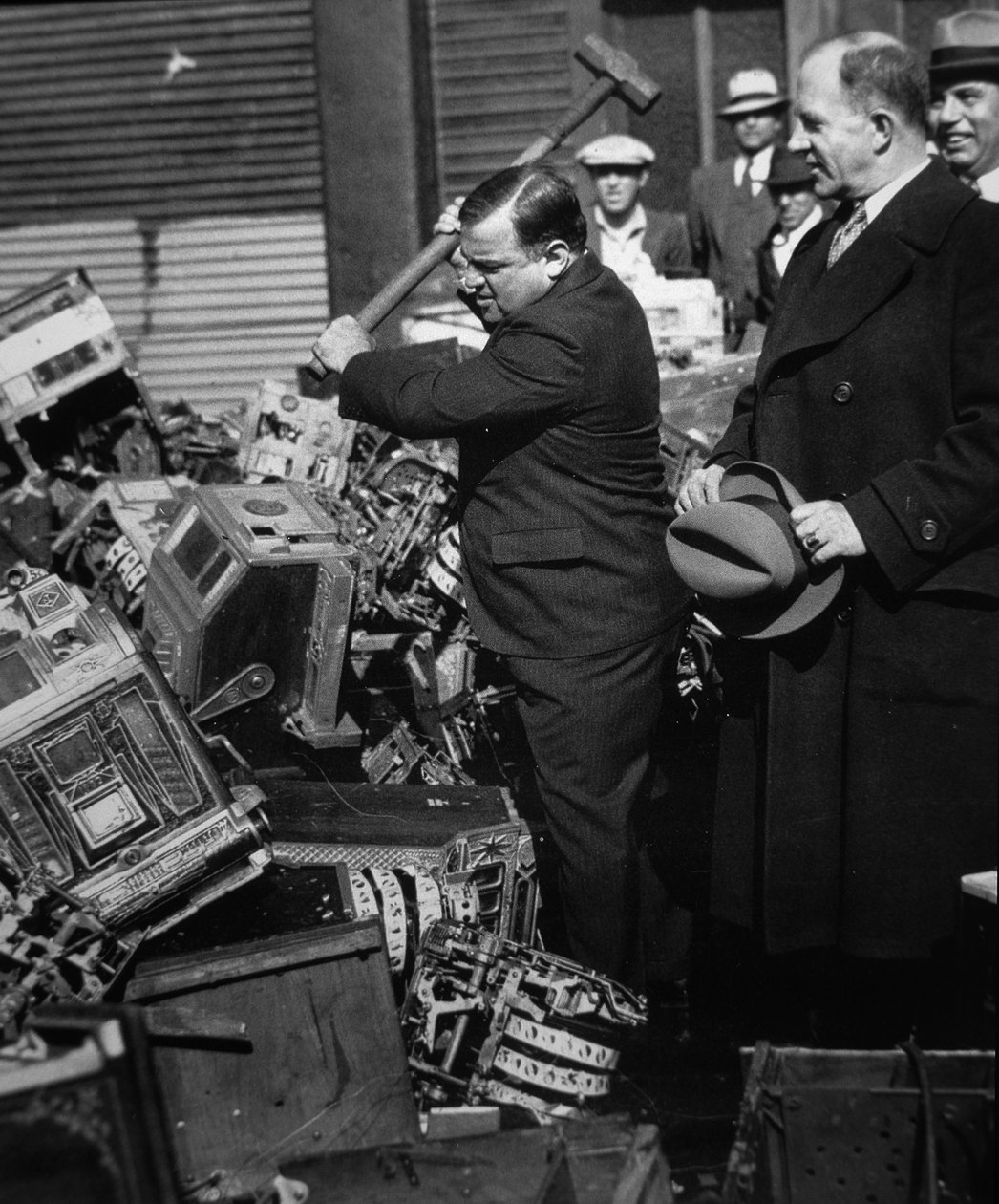 Fiorello La Guardia (1882-1947) smashing confiscated slot machines by American Photographer