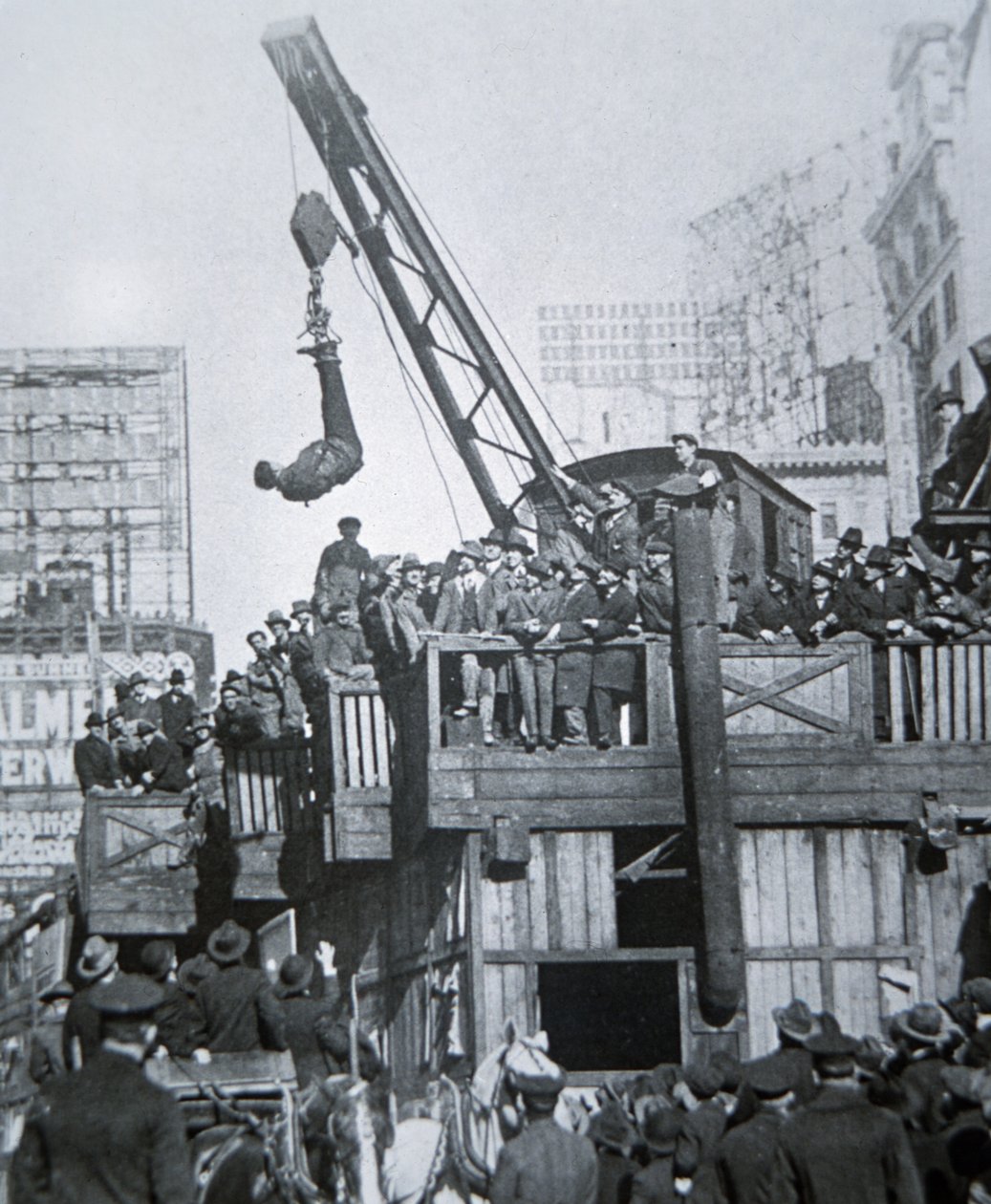 Houdini Escaping from a Strait-Jacket While Suspended from a Crane in New York City by American Photographer
