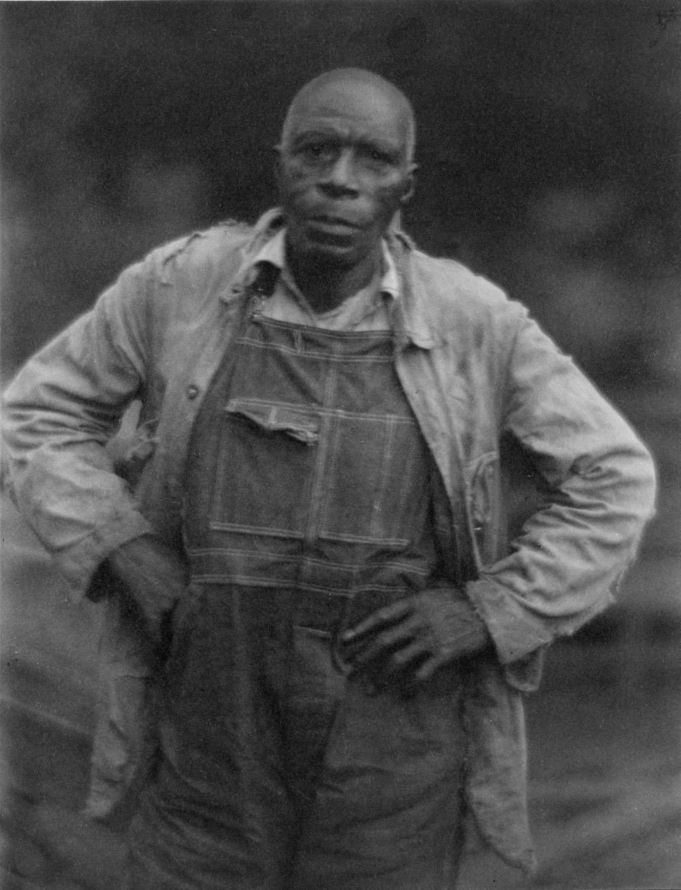 Man in Overalls by American Photographer