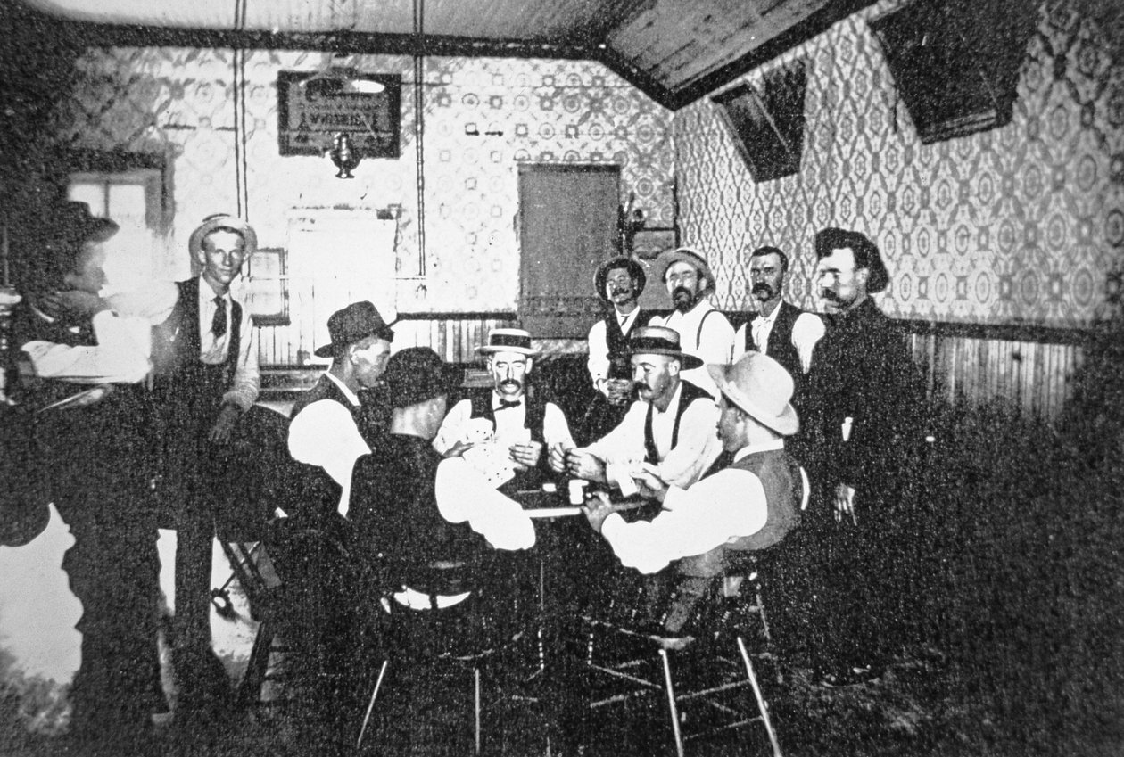 Playing cards in a Western saloon, c.1900 by American Photographer