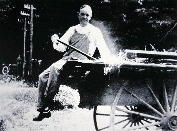 President Calvin Coolidge (1873-1933) posing as a farmer during a vacation in Vermont by American Photographer