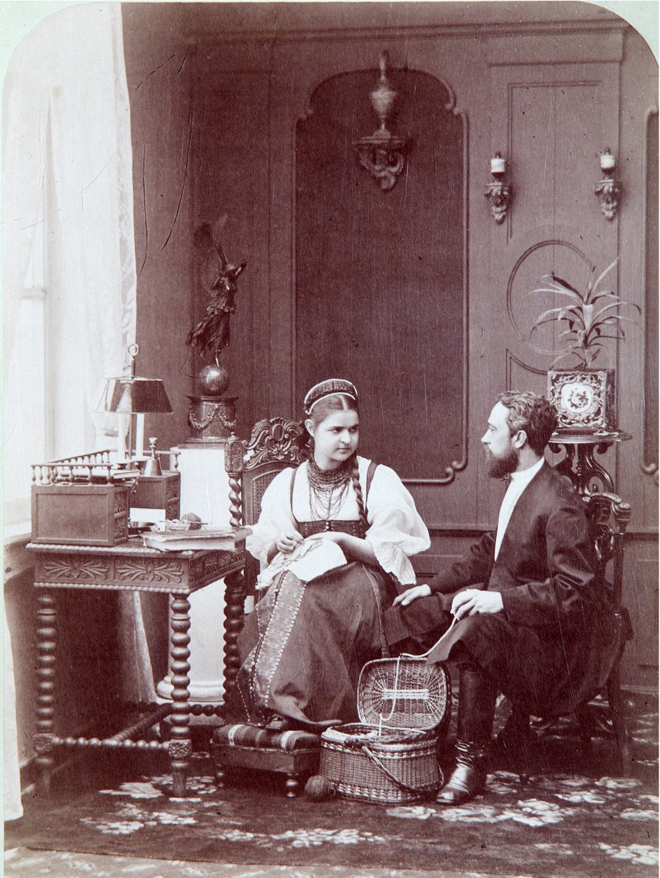 Composition a la russe: interior of a Russian home with man and woman embroidering and dressed in traditional costume. Photograph by Andrei Osipovich Karelin (1837-1906), 1870-1880. State Museum of History, Moscow by Andrei Osipovich Karelin