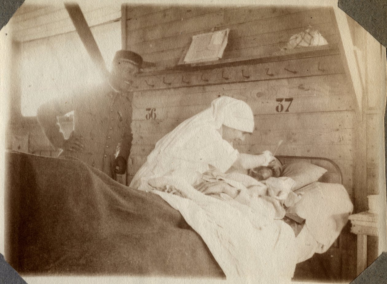 First World War 1914-1918: nurse shaving a soldier in Couville, Lower Normandy, France. Anonymous photograph July 1917. Private collection, Stella. by Anonymous Anonymous