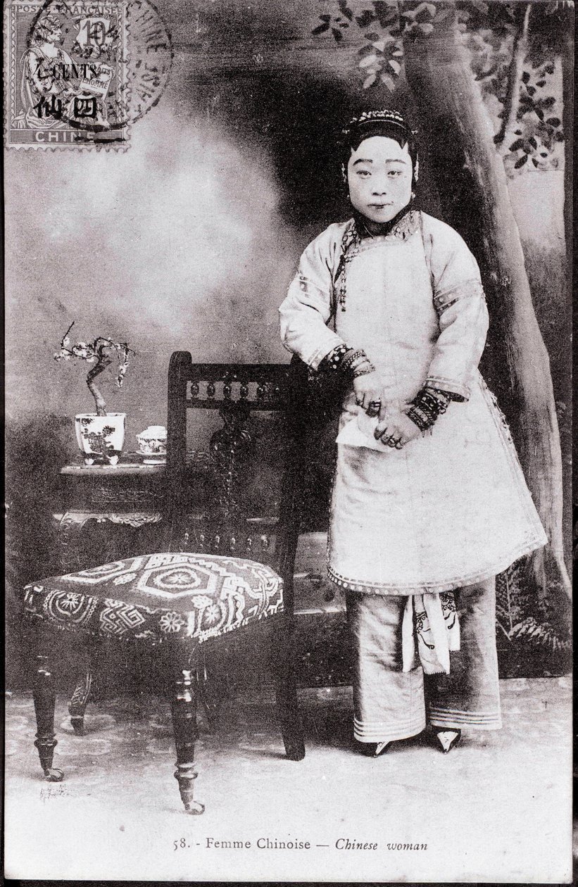 Portrait of a young Chinese woman in traditional costume. She has bound feet. Photography from the beginning of the 20th century. Private collection by Anonymous Anonymous