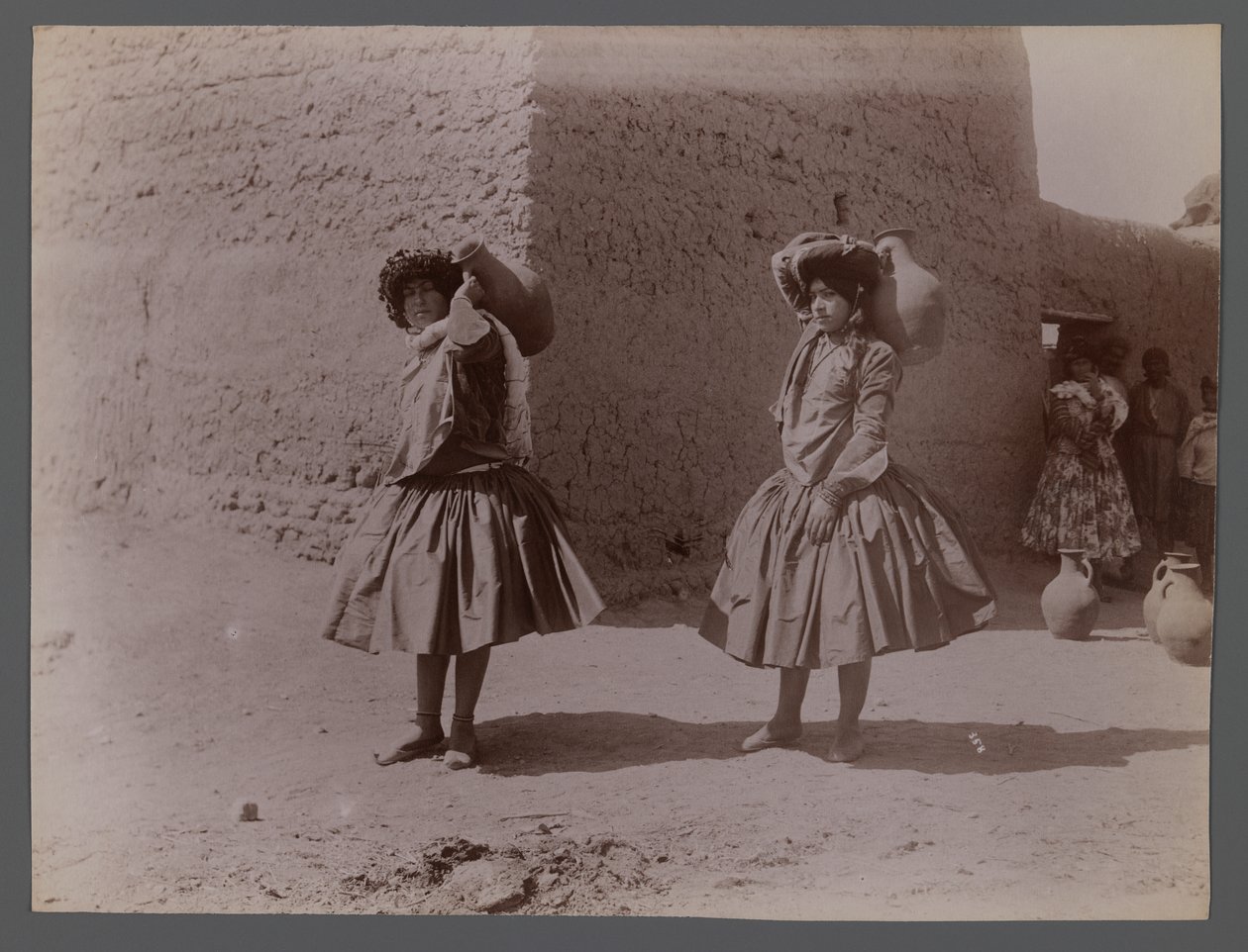 Two women carrying clay jugs by Antoin Sevruguin