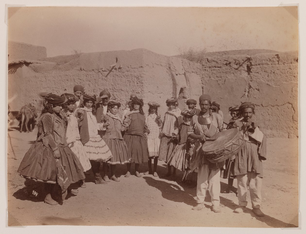 Group of women dancing in tribal costume by Antoin Sevruguin