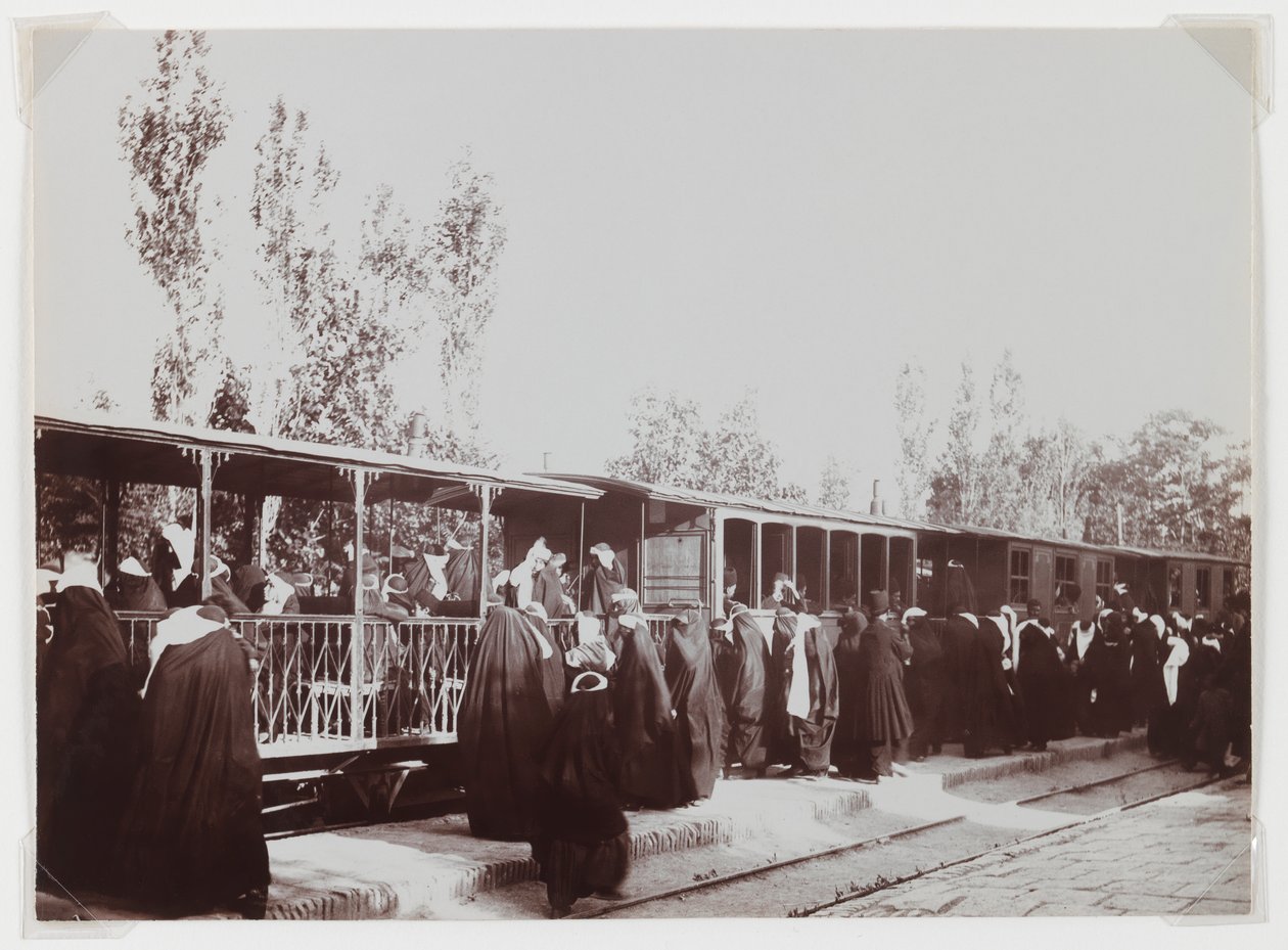 Veiled women boarding a train by Antoin Sevruguin