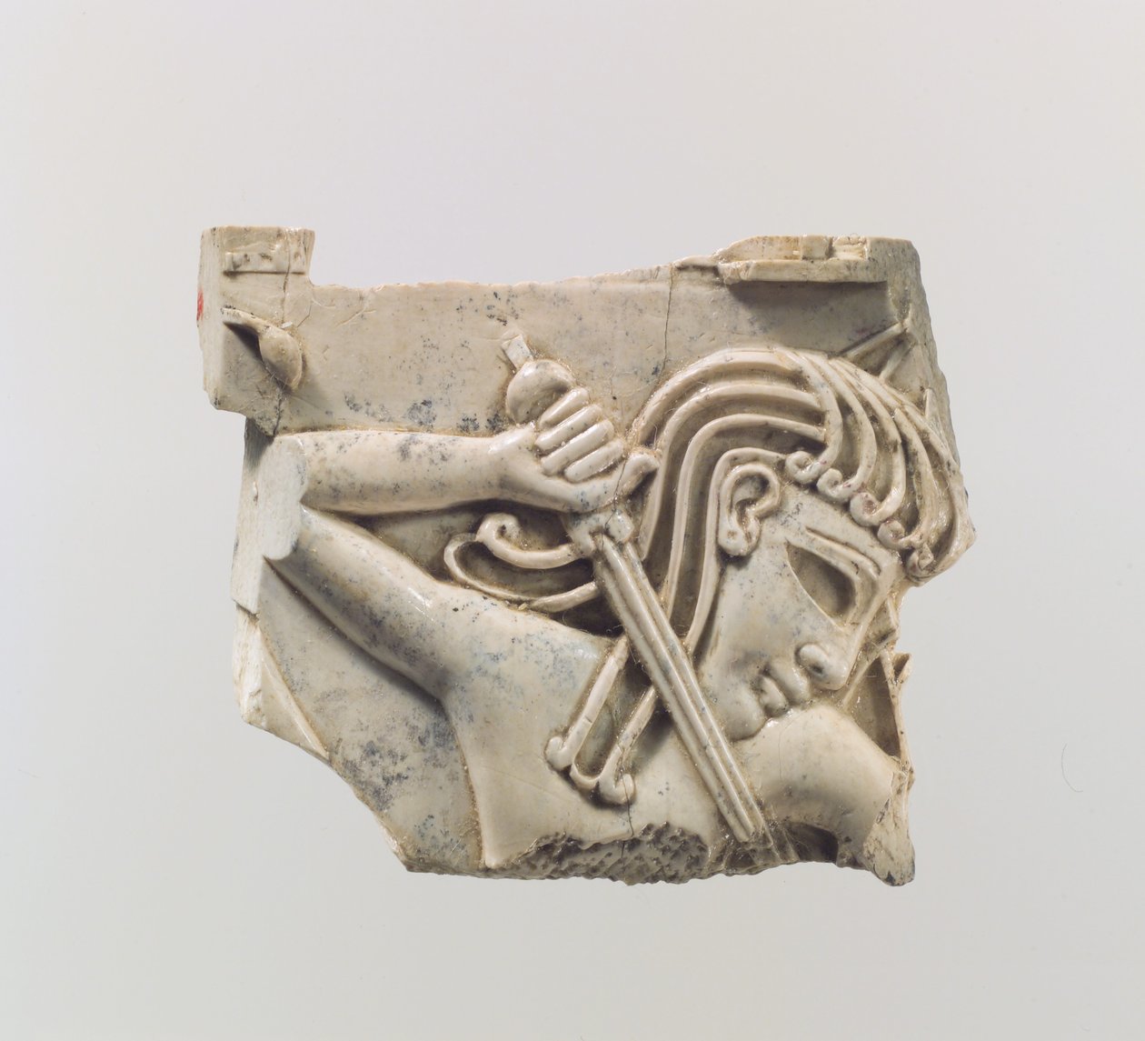 Cloisonné furniture plaque with a figure holding a sword, c.9th–8th century BC by Assyrian