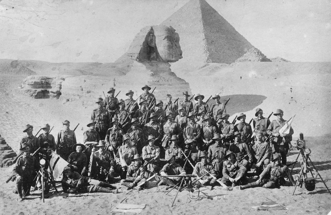 Informal Group Portrait of an Australian Infantry Signal School in Front of the Sphinx and Pyramid. Signalling Equipment is in the Foreground, c.1915 by Australian Photographer