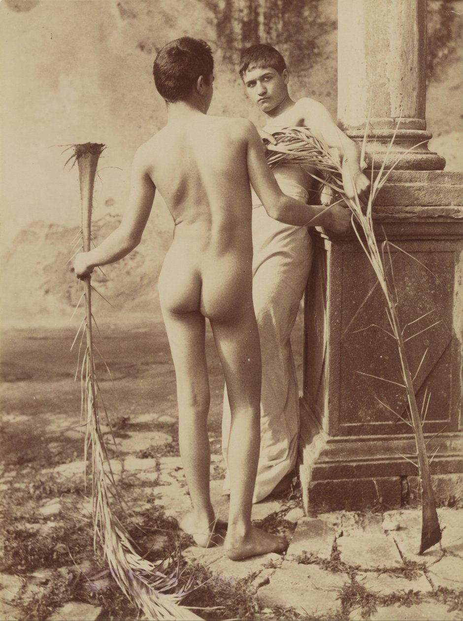 Two Male Youths Holding Palm Fronds by Baron Wilhelm von Gloeden