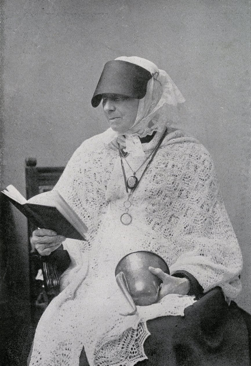 Jane Whyte Balfour, aunt of Robert Louis Stevenson, reading and holding an ear trumpet by British Photographer