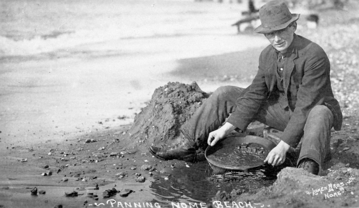 Man Panning Gold on Beach, Nome, Alaska, c.1910 by Brothers Lomen
