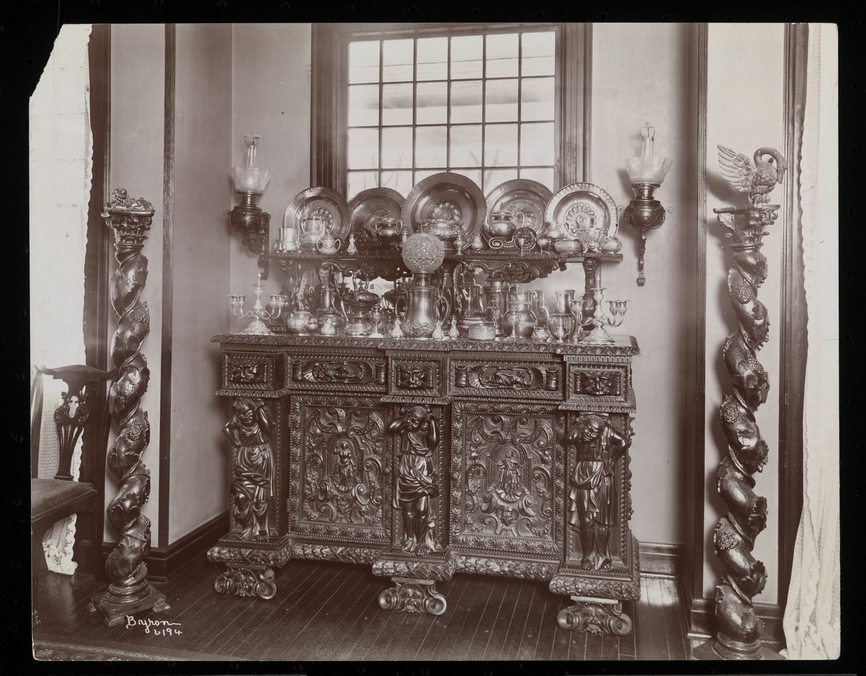 A Cluttered Sideboard at the Westmoreland Davis Residence in Tuxedo Park, New York, 1899 by Byron Company