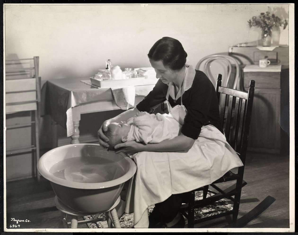 A woman washing a baby