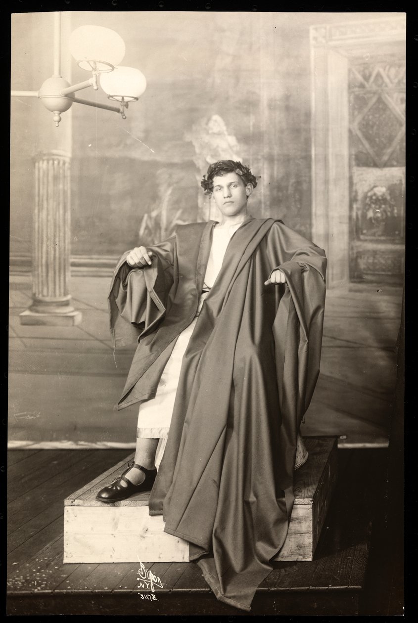 A young actor in the costume of Julius Caesar of the set of an amateur production of Julius Caesar by Byron Company