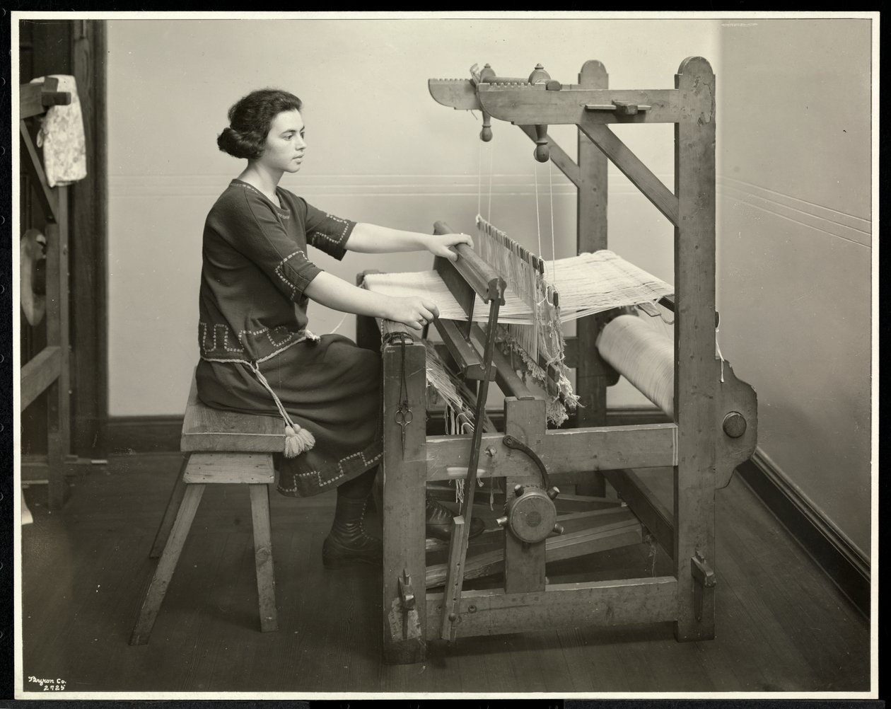 Blind woman working at a loom at the New York Association for the Blind, 111 East 59th Street, New York by Byron Company